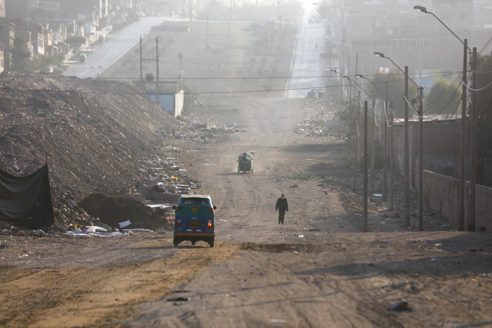 A voter walks towards a polling post during general elections amid the new coronavirus pandemic in Lima, Peru, Sunday, April 11, 2021. (AP Photo/Guadalupe Pardo)