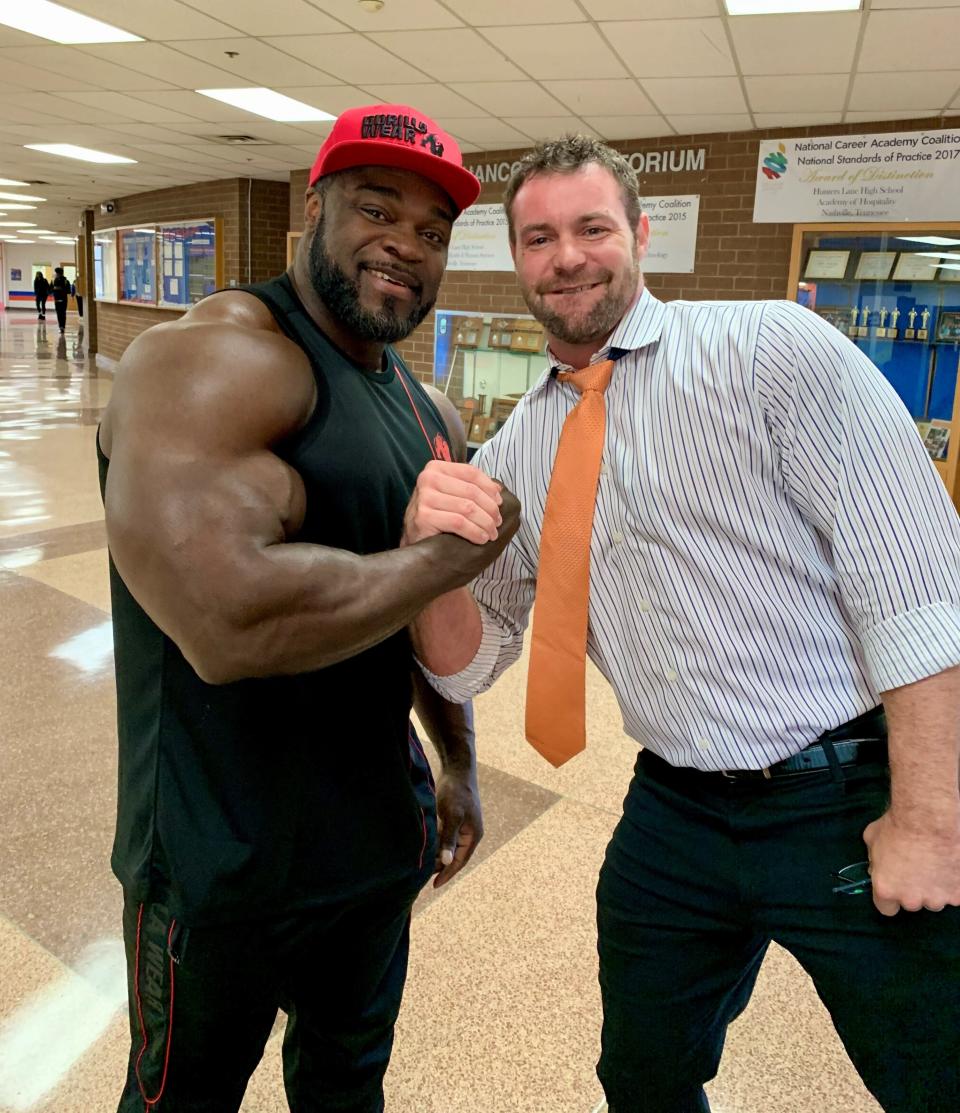 A 2019 picture of Hunters Lane teacher Clay Meacham, right, with Hunters Lane alum Brandon Curry shortly after Curry won the Mr. Olympia title