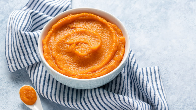 mashed pumpkin in white bowl 