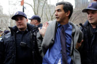 <p>New York City Council member Ydanis Rodriguez is detained by police during a demonstration by activists against deportation outside the Jacob Javits Federal Building in Manhattan in New York City, Jan. 11, 2018. (Photo: Eduardo Munoz/Reuters) </p>