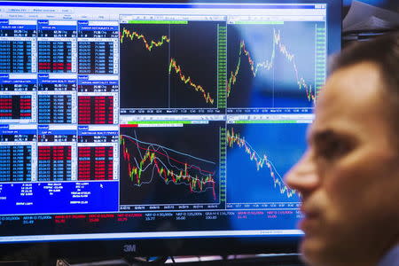 A trader works on the floor of the New York Stock Exchange shortly before the closing bell, June 29, 2015. REUTERS/Lucas Jackson