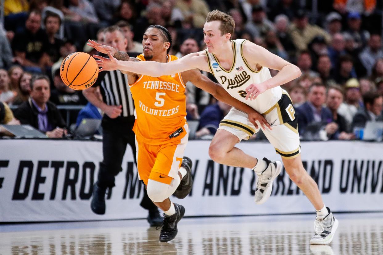 Purdue guard Fletcher Loyer (2) and Tennessee guard Zakai Zeigler (5) battle for the loose ball during the first half of the NCAA tournament Midwest Regional Elite 8 round at Little Caesars Arena in Detroit on Sunday, March 31, 2024.