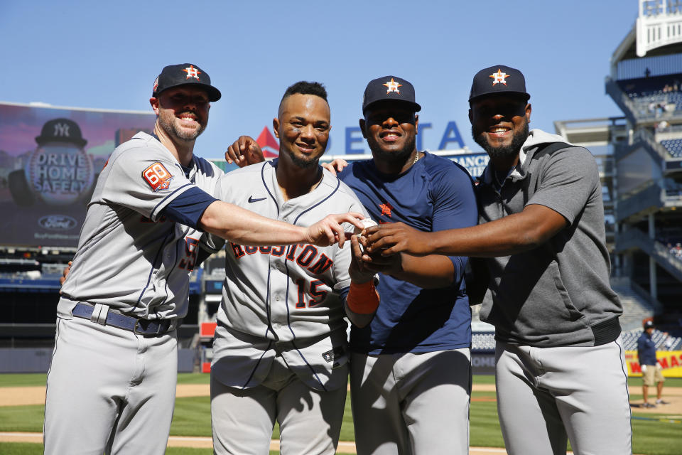 Houston Astros players, from left, relief pitcher Ryan Pressly, catcher Martin Maldonado, relief pitcher Hector Neris, and starting pitcher Cristian Javier celebrate after a combined no-hitter against the New York Yankees. Saturday, June 25, 2022, in New York. The Houston Astros won 3-0. (AP Photo/Noah K. Murray)