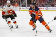 Jan 19, 2019; Edmonton, Alberta, CAN; Edmonton Oilers forward Connor McDavid (97) looks to make a pass in front of Calgary Flames forward Johnny Gaudreau (13) during the first period at Rogers Place. Mandatory Credit: Perry Nelson-USA TODAY Sports