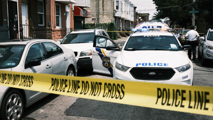 Police tape blocks a street where a person was shot in a drug-related incident in Philadelphia in 2021.