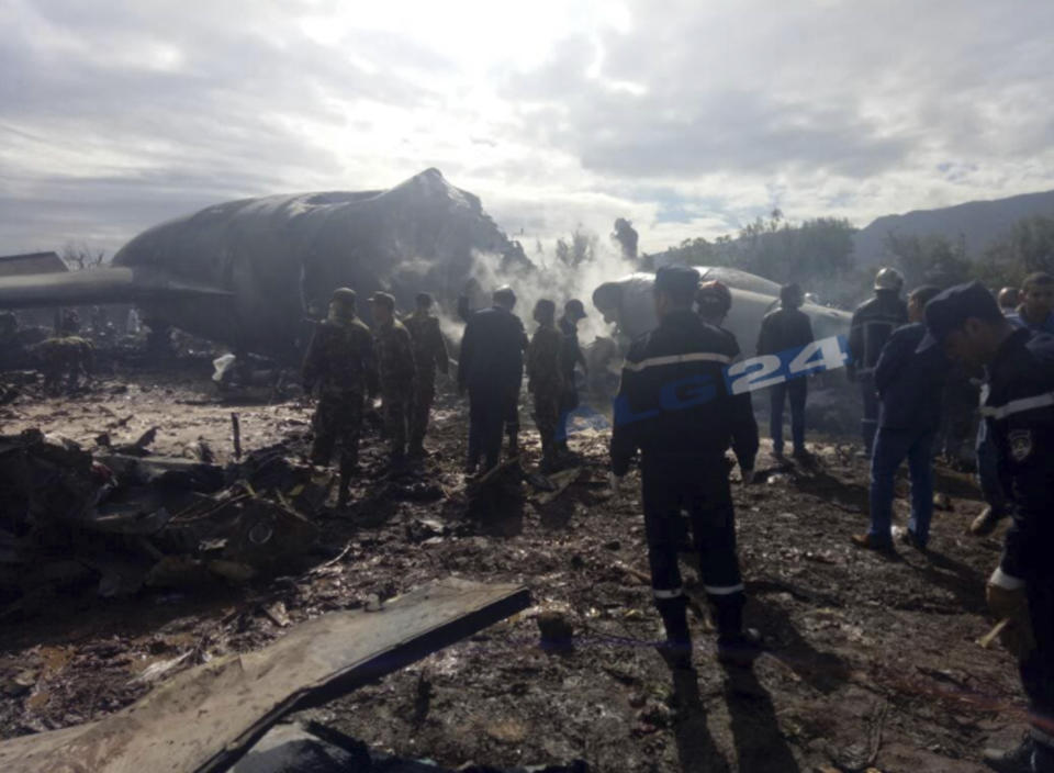 <p>This image dated April 11, 2018, and posted by Algerian news agency ALG24, shows firefighters and soldiers at the scene of a fatal military plane crash near Boufarik military base near the Algerian capital, Algiers. (Photo: ALG24 via AP) </p>