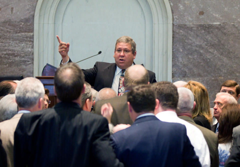 House Majority Leader Gerald McCormick, of Chattanooga, speaks to fellow Republican lawmakers during a break in a House floor session in Nashville, Tenn., on Thursday, April 12, 2012. The chamber later voted to reduce the state's taxes on estates and groceries. (AP Photo/Erik Schelzig)