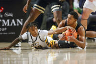 Virginia Commonwealth guard Nick Kern (24) tries to steal the ball from Vanderbilt guard Jordan Wright (4) during the first half of an NCAA college basketball game, Wednesday, Nov. 30, 2022 at Seigel Center in Richmond, Va. (Shaban Athuman/Richmond Times-Dispatch via AP)