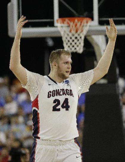 Gonzaga&#39;s Przemek Karnowski reacts during the second half of a college basketball regional semifinal game in the NCAA Tournament against UCLA, Friday, March 27, 2015, in Houston. (AP Photo/David J. Phillip)