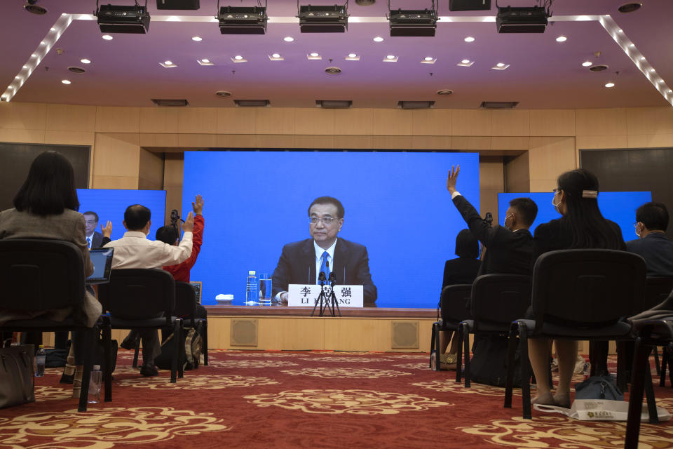 Chinese Premier Li Keqiang waits for questions on screen during a press conference by video conferencing at the end of the National People's Congress in Beijing on Thursday, May 28, 2020. China’s ceremonial legislature on Thursday endorsed a national security law for Hong Kong that has strained relations with the United States and Britain. (AP Photo/Ng Han Guan, Pool)