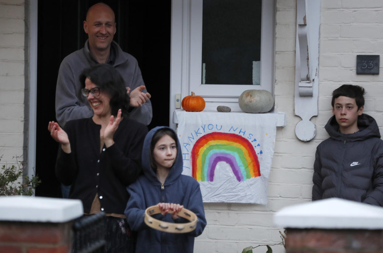 People join the nationwide 'Clap for Carers' on April 16, 2020. (AP)