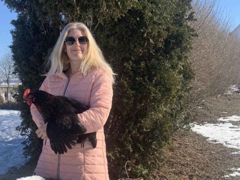 Chatham-Kent resident Charlotte Bordenuk says she is fighting a $240 fine for her chickens wandering into the church yard next door. She said the chickens are kept in an agriculturally zoned part of her property.  (Submitted by Charlotte Bordenuk - image credit)
