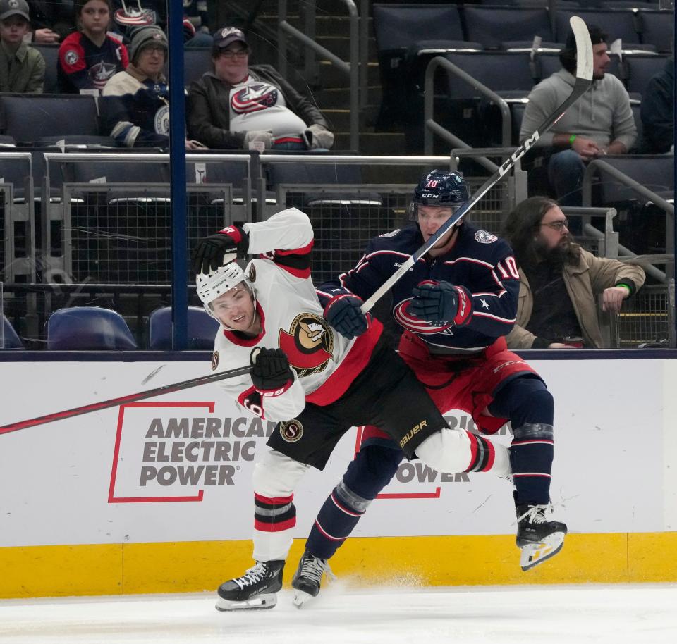 Dec. 1, 2023; Columbus, Ohio, USA; 
Ottawa Senators defenseman Erik Brannstrom (26) and Columbus Blue Jackets left wing Dmitri Voronkov (10) collide during the first period of FridayÕs hockey game at Nationwide Arena.