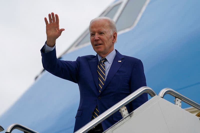 FILE PHOTO: U.S. President Joe Biden waves as he departs for Indonesia, in Phnom Penh