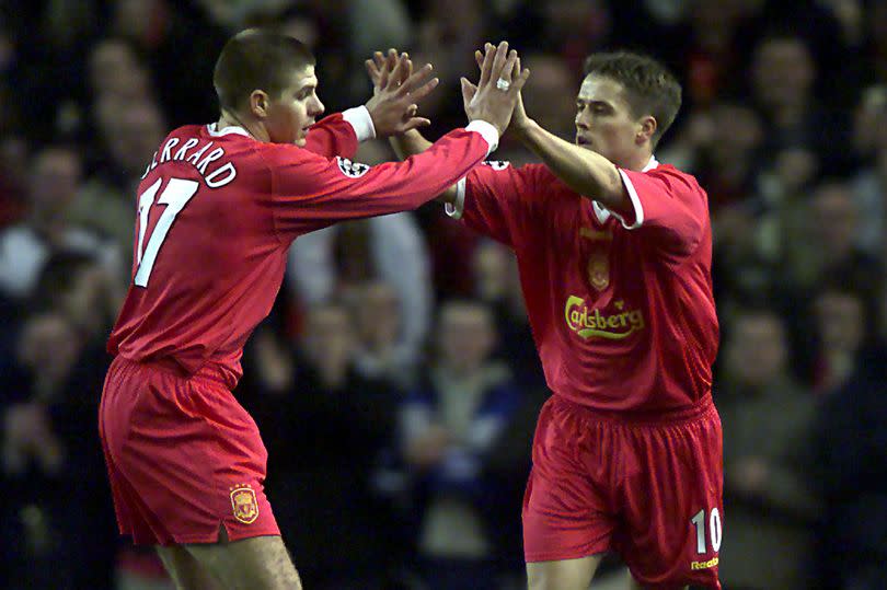 Liverpool's Michael Owen celebrates with team-mate Steven Gerrard