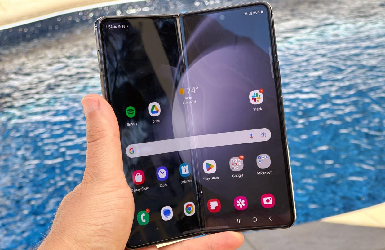  Samsung Galaxy Z Fold 5 in front of pool . 