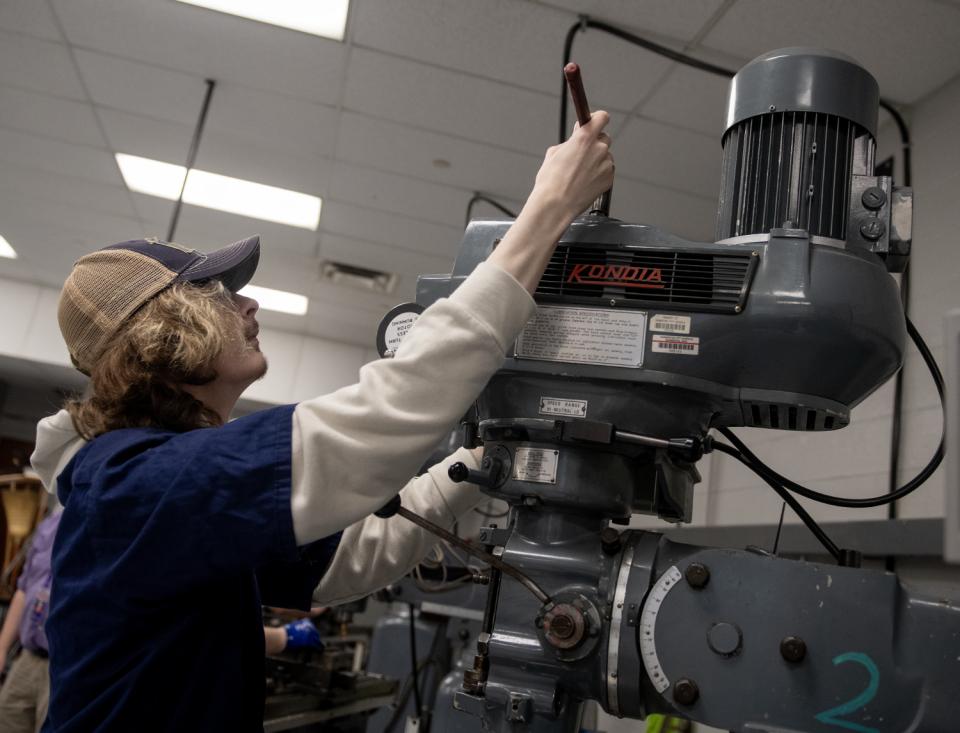 Conner Burnley, 17, works on drilling at Barberton High School.