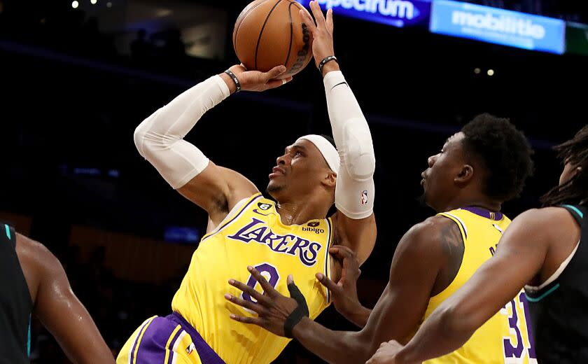 LOS ANGELES, CALIF. - NOV. 30, 2022. Lakers guard Russell Westbrook gets fouled en route to the. basket against the Blazers in the first quarter of the game at crypto.com Arena in Los Angeles on Wednesday night, Nov. 30, 2022. (Luis Sinco / Los Angeles Times)