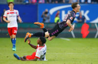 Soccer Football - Bundesliga - Hamburger SV vs SC Freiburg - Volksparkstadion, Hamburg, Germany - April 21, 2018 Hamburg's Gideon Jung fouls SC Freiburg's Florian Kath REUTERS/Morris Mac Matzen