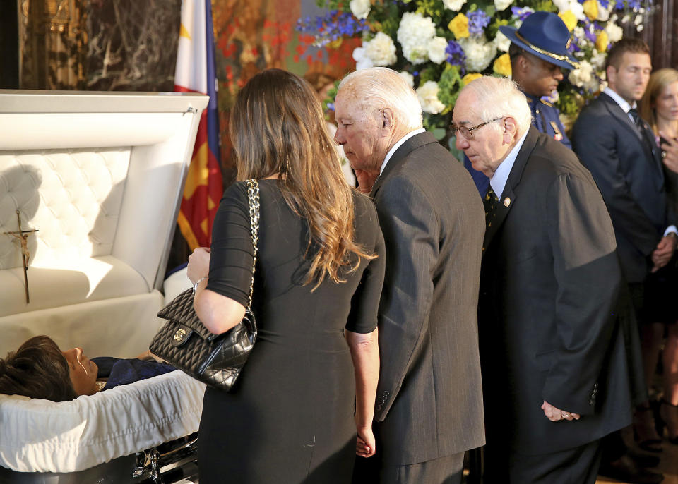 Former Governor Edwin Edwards, center, joins Raymond Blanco, right, as they pay their respects to former Louisiana Gov. Kathleen Babineaux Blanco, as she lies in state in the state capitol rotunda in Baton Rouge, La., Thursday, Aug. 22, 2019. Thursday was the first of three days of public events to honor Blanco, the state's first female governor who died after a years long struggle with cancer.(AP Photo/Michael Democker, Pool)