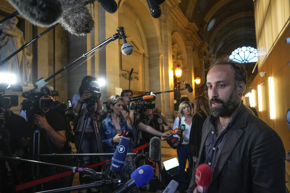 Arthur Deouveaux survivor of the Bataclan attack and president of life for Paris association speaks to the media after the verdict in Paris Wednesday, June 29, 2022. The lone survivor of a team of Islamic State extremists was convicted Wednesday of murder and other charges and sentenced to life in prison without parole in the 2015 bombings and shootings across Paris that killed 130 people in the deadliest peacetime attacks in French history. (AP Photo/Michel Euler)
