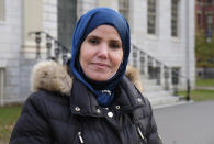 Samia Omar, a chaplain at Harvard University, poses for a portrait at Harvard Yard in Cambridge, Mass., Nov. 30, 2021. Omar and her husband, Imam Khalil Abdur-Rashid, who co-founded The Islamic Seminary of America together and now serve as Harvard’s Muslim chaplains, offer programming and mentoring for Muslim students on campus. (Aysha Khan/Religion News Service via AP)