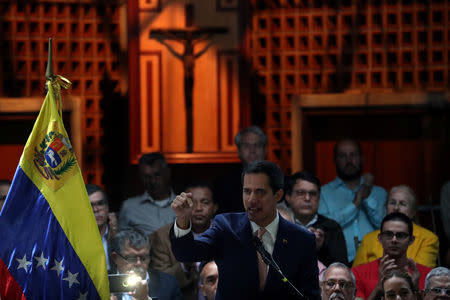 Venezuelan opposition leader Juan Guaido, who many nations have recognized as the country's rightful interim ruler, attends a meeting with political leaders at a university in Caracas, Venezuela April 1, 2019. REUTERS/Ivan Alvarado