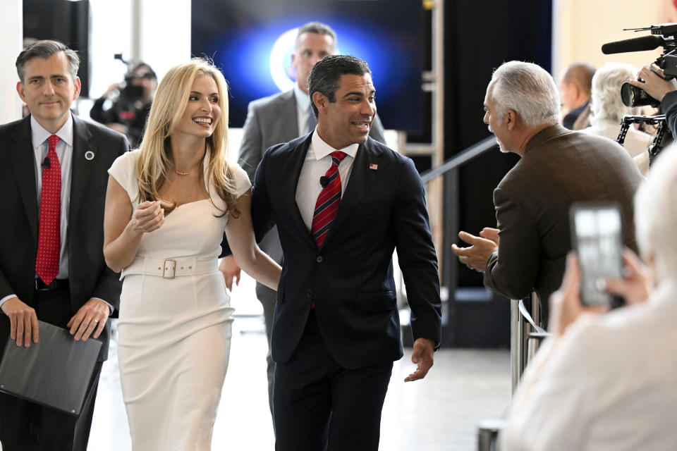 FILE - Miami Mayor Francis Suarez, second from right, departs with his wife, Gloria Suarez, after speaking at the "Time for Choosing" series at the Ronald Reagan Presidential Library Thursday, June 15, 2023, in Simi Valley, Calif. (AP Photo/Michael Owen Baker, File)