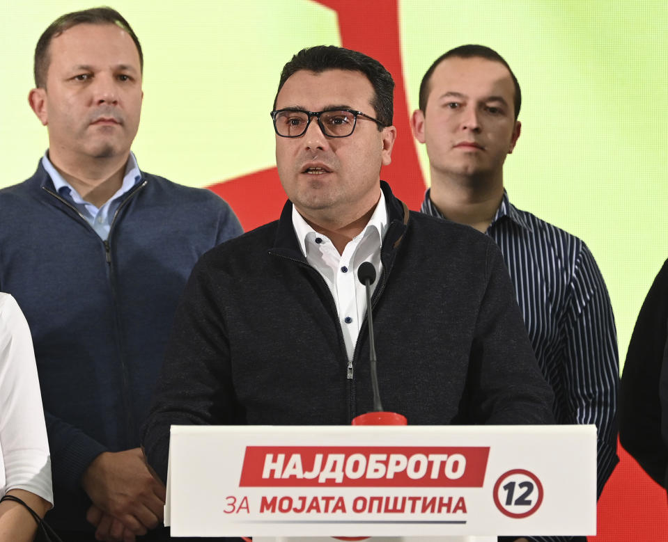 North Macedonia's Prime Minister Zoran Zaev, center, talks during a news conference at the party headquarters in Skopje, North Macedonia, late Sunday, Oct. 31, 2021. Zaev announced his resignation as prime minister and leader of Social-democratic Union after oppositional center-right coalition won a landslide victory on local elections. (AP Photo)