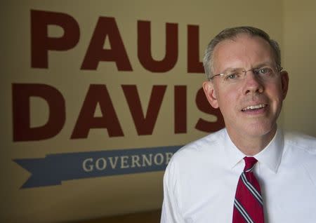 Kansas House Minority Leader and the Democratic candidate for Governor Paul Davis poses for a photographer at his campaign headquarters in Lawrence Kansas July 24, 2014. REUTERS/Dave Kaup