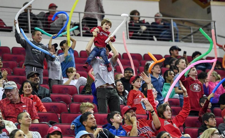 Fresno State fans dance during a timeout in the Bulldogs’ game with Utah State at the Save Mart Center in Fresno on Saturday, Jan. 28, 2023.