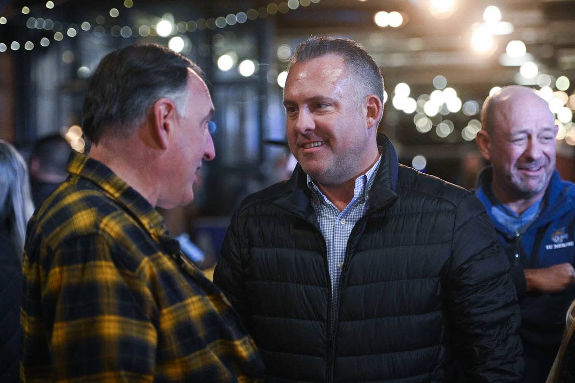 Adam Gray, right, greets a supporter during his election night party Tuesday, Nov. 8, 2022 in Atwater, CA.