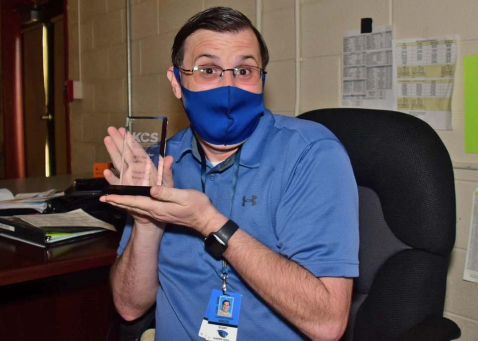 Audio/Visual Production instructor Chris Wade shows his Teacher of the Year award at Byington-Solway Technology Center on March 23, 2021.