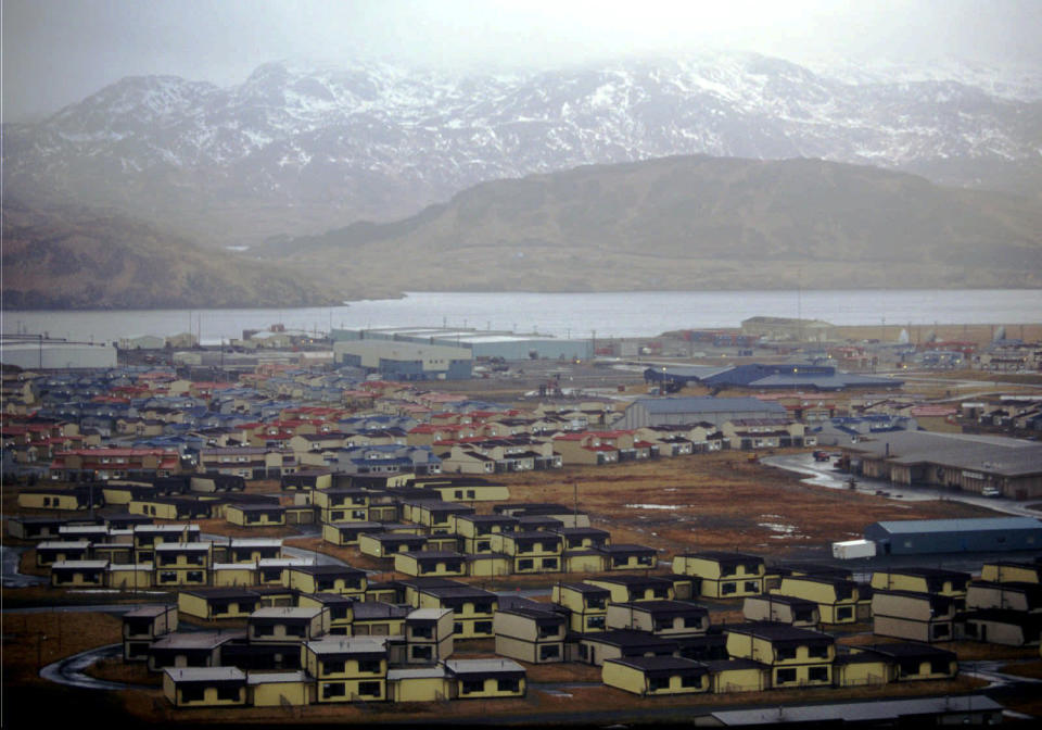 FILE - In this February 1997 file photo, hundreds of houses, which over 6,000 military personnel and dependents called home, along with schools, warehouses, hangars, and other structures sit empty on the Adak Naval Air Facility in Alaska. The Trump administration is considering using West Coast military bases or other federal properties as transit points for shipments of U.S. coal and natural gas to Asia. (AP Photo/Al Grillo, File)