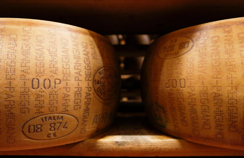 A storage area for Parmesan cheese wheels is pictured at storehouse shelf at 4 Madonne Caseificio dell'Emilia dairy cooperative in Modena, Italy, February 16 2016. / Credit: Alessandro Bianchi / REUTERS