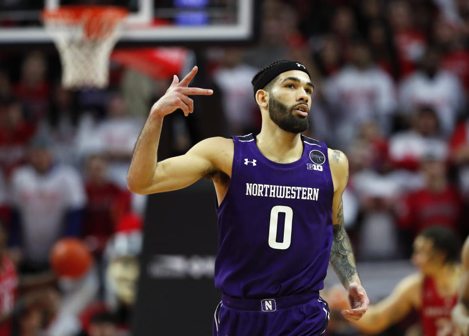 Northwestern guard Boo Buie (0) reacts after making a three point shot against Rutgers during the second half of an NCAA college basketball game, Sunday, March 5, 2023, in Piscataway, N.J. Northwestern won 65-53. (AP Photo/Noah K. Murray)