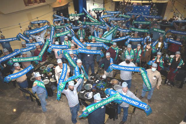 <p>Hilcorp</p> Hilcorp Energy team members celebrate the completion of Northbound 275, one of their "Big Hairy Audacious Goals."