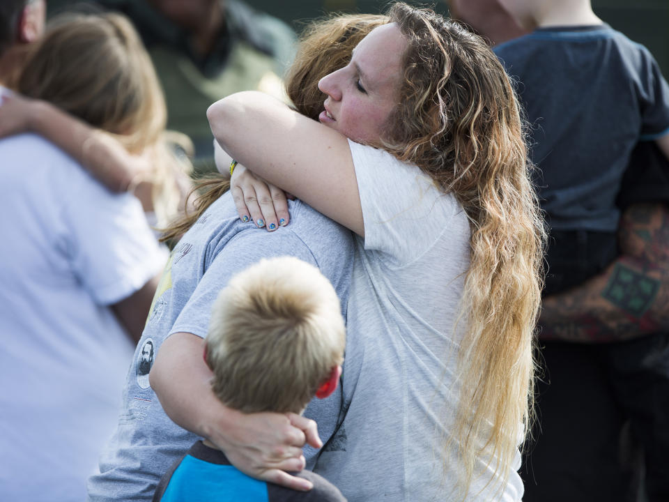 <p>Korrie Bennett hugs Heather Bailey after recovering their children following a shooting at Townville Elementary in Townville Wednesday, Sept. 28, 2016. (Katie McLean/The Independent-Mail via AP) </p>