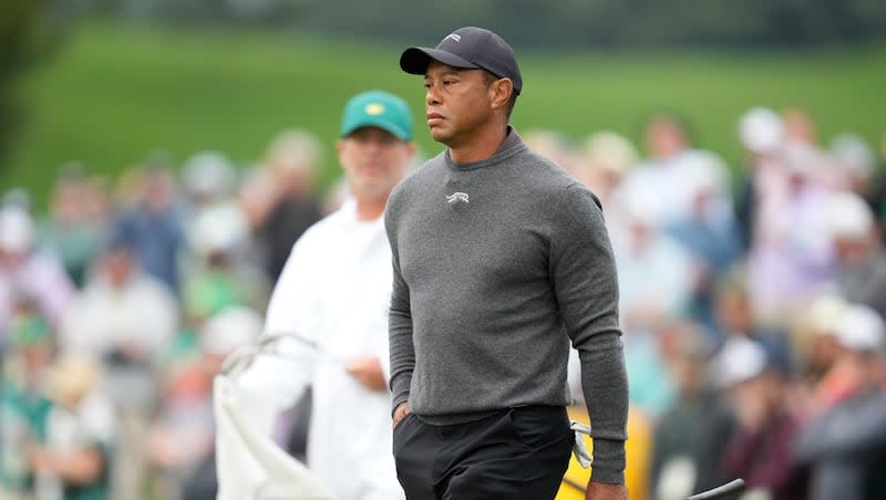 Tiger Woods watches his putt on the second green during a practice round in preparation for the Masters golf tournament at Augusta National Golf Club Tuesday, April 9, 2024, in Augusta, Ga.