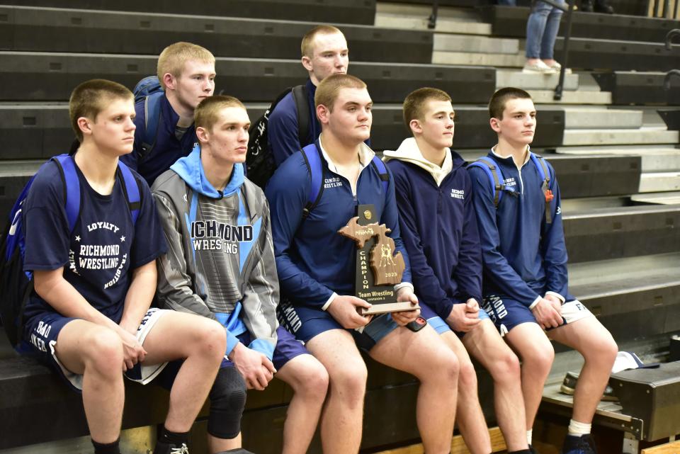 Members of the Richmond wrestling team pose for a photo after beating Yale, 44-26, in a Division 3 district final at Armada High School on Thursday.