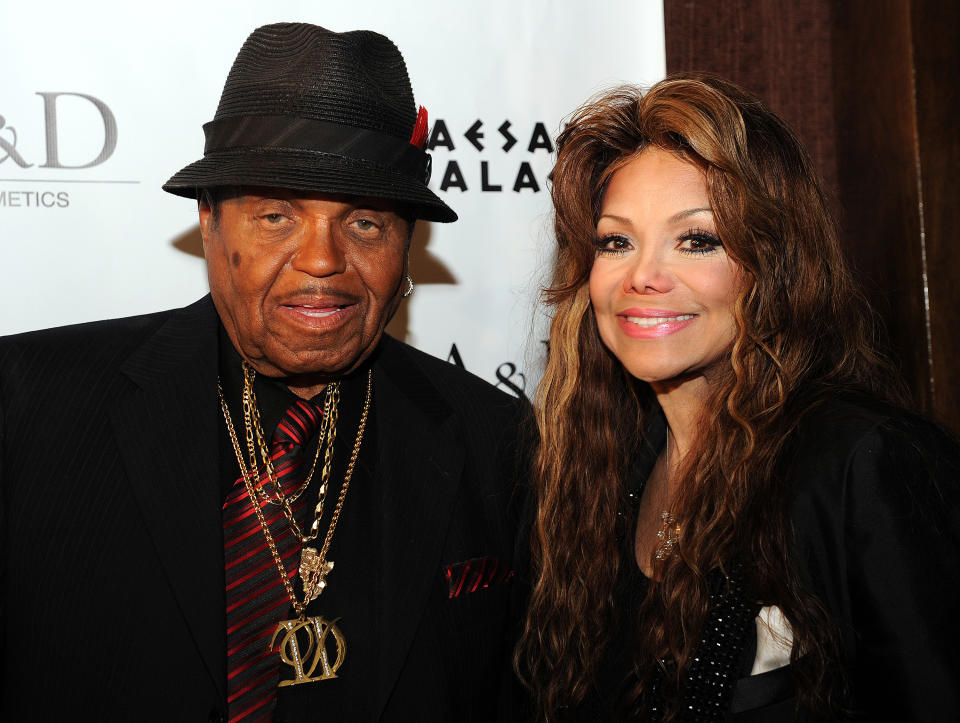 Joe Jackson and his daughter La Toya Jackson pose in Las Vegas on June 9, 2011. She is one of the family members sharing an online tribute to the controversial talent manager. (Photo: Gabriel Bouys/AFP/Getty Images)