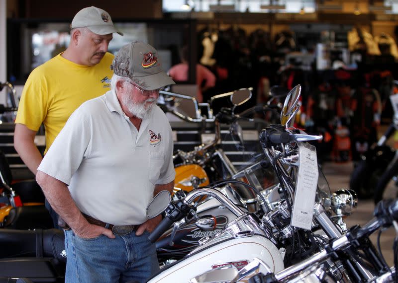 FILE PHOTO: Customers look at the showroom inventory at Harley-Davidson of Frederick in Frederick Maryland