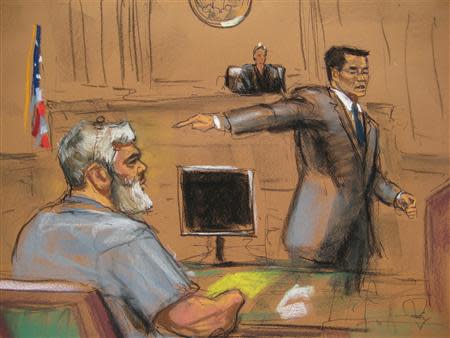 Assistant U.S. Attorney Edward Kim (R) points towards Abu Hamza al-Masri, the radical Islamist cleric facing U.S. terrorism charges, in Manhattan federal court in New York in this artist's sketch, April 17, 2014. REUTERS/Jane Rosenberg