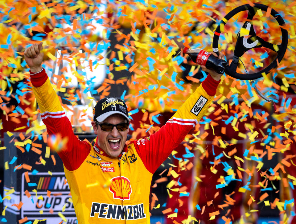 November 6, 2022;  Avondale, Arizona, USA;  NASCAR Cup Series driver Joey Logano celebrates after winning the Cup championship at Phoenix Raceway.  MANDATORY CREDIT: Mark J. Rebilas-USA TODAY Sports TPX IMAGES OF THE DAY