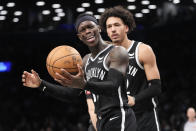 Brooklyn Nets guard Dennis Schroder, foreground, and forward Jalen Wilson reacts during the second half of an NBA basketball game against the Toronto Raptors, Wednesday, April 10, 2024, in New York. The Nets won 106-102. (AP Photo/Mary Altaffer)