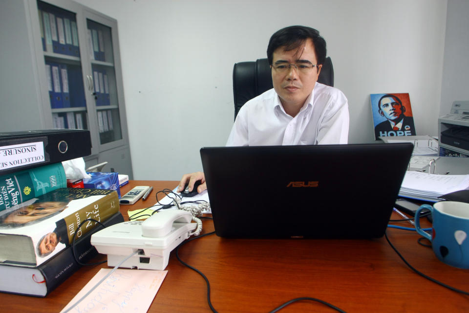 Le Quoc Quan, one of Vietnam's better-known dissidents and a leading blogger, works at his office in Hanoi, Vietnam on Friday, Sept. 28, 2012. The Internet has become the principal staging ground for dissent in Vietnam, and its Communist rulers are trying to clamp down with new laws, stepped up arrests, intimidation and longer prison sentences. But so far, it’s a battle they are losing. (AP Photo/Na Son Nguyen)