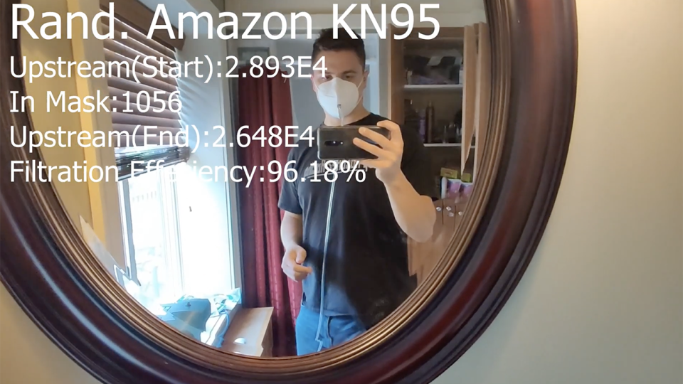 Collins tests an Amazon KN95 mask. (screengrab via Aaron Coliins/YouTube)