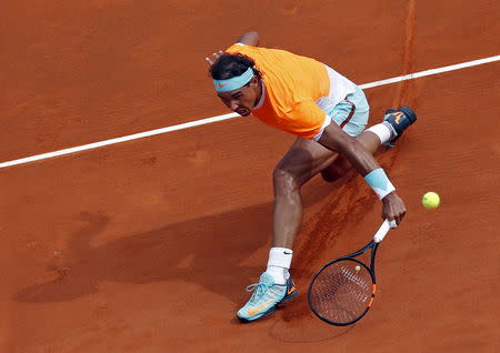 Rafael Nadal of Spain returns the ball to Novak Djokovic of Serbia during their semi-final match at the Monte Carlo Masters in Monaco April 18, 2015. REUTERS/Jean-Paul Pelissier