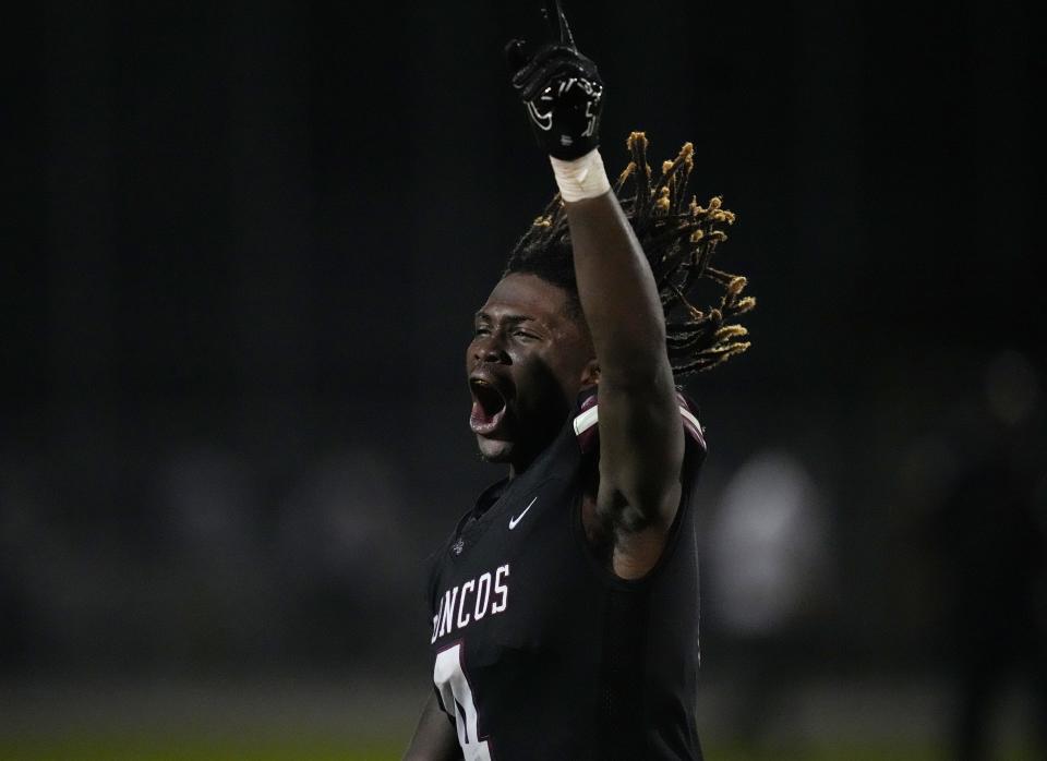 Luby Maurice Jr. (4) celebrates the 14-10 victory over Palm Beach Gardens in the 4M Regional Final on Friday, Nov. 25, 2022 in Wellington. 