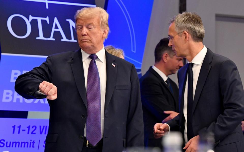 Time's Up: President Donald Trump checks his watch at a Nato Summit, 2018